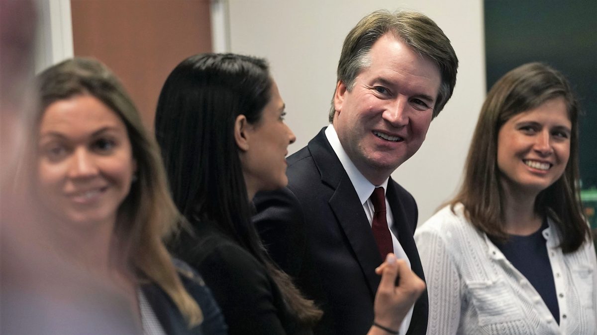 WASHINGTON, DC - JULY 19: Supreme Court nominee Judge Brett Kavanaugh (2nd R) waits for a meeting with U.S. Sen. Dean Heller (R-NV) on Capitol Hill July 18, 2018 in Washington, DC. Kavanaugh is meeting with members of the Senate after U.S. President Donald Trump nominated him to succeed retiring Supreme Court Associate Justice Anthony Kennedy. 