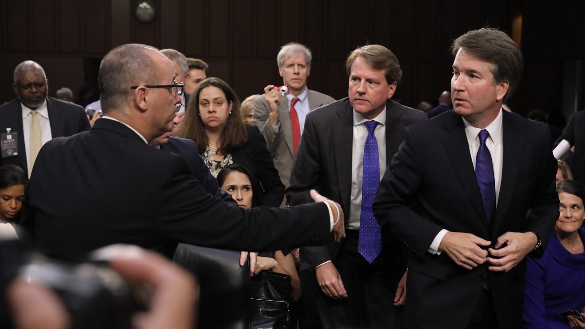 Fred Guttenberg (L), father of murdered Marjory Stoneman Douglas High School student Jamie Guttenberg, tries to shake the hand of Supreme Court nominee Judge Brett Kavanaugh as Kavanaugh appeared before the Senate Judiciary Committee during his Supreme Court confirmation hearing in the Hart Senate Office Building on Capitol Hill September 4, 2018 in Washington, DC.