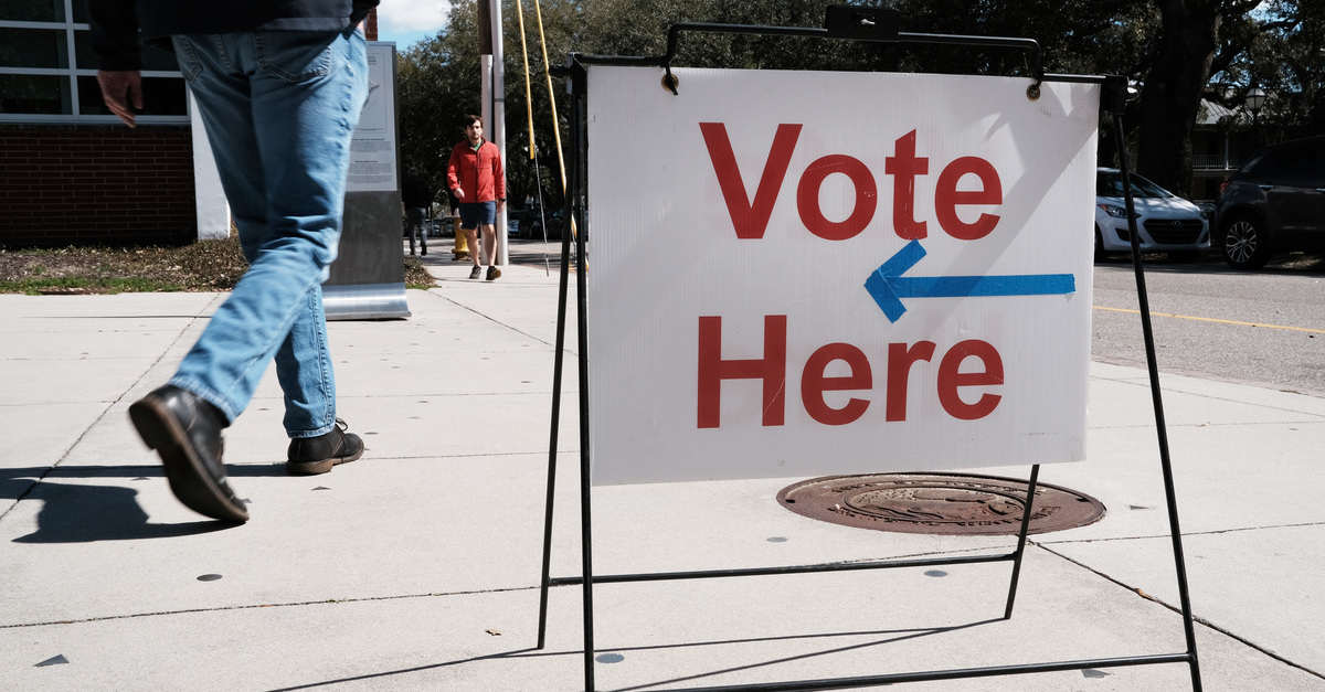 People walk past a polling station in Charleston, S.C., on Feb. 29, 2020. (Photo by Spencer Platt/Getty Images.)