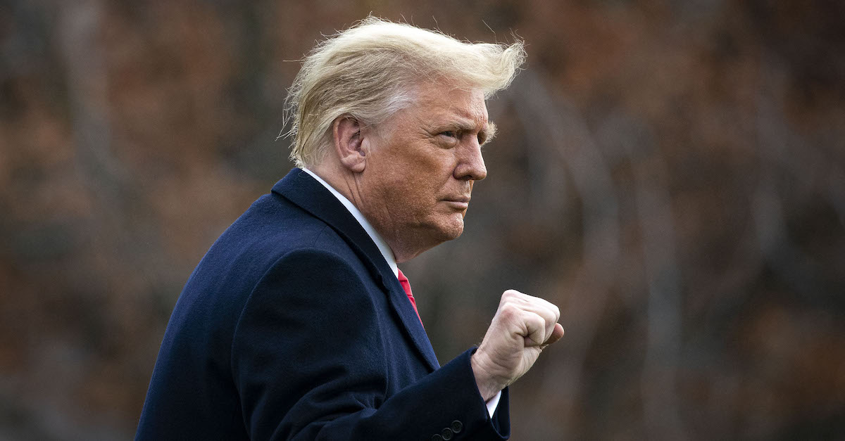 WASHINGTON, DC - DECEMBER 12: U.S. President Donald Trump pumps his fist as he departs on the South Lawn of the White House, on December 12, 2020 in Washington, DC. Trump is traveling to the Army versus Navy Football Game at the United States Military Academy in West Point, NY.