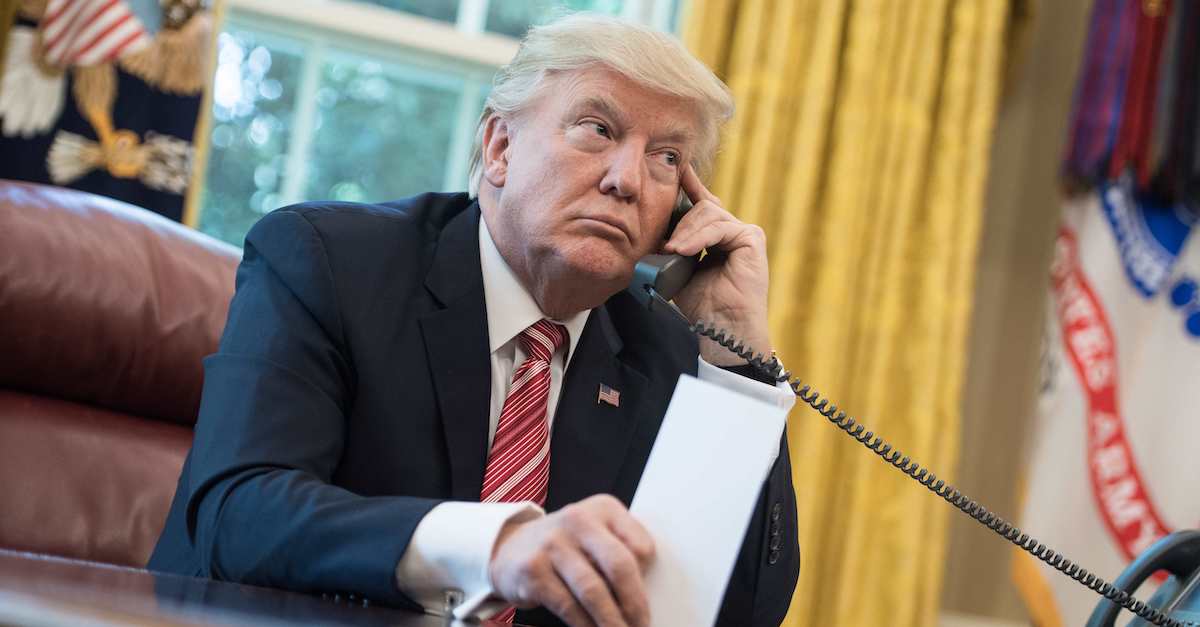 US President Donald Trump on a call from the Oval Office at the White House in Washington, DC, on June 27, 2017. (Photo by NICHOLAS KAMM / AFP) (Photo credit should read NICHOLAS KAMM/AFP via Getty Images)