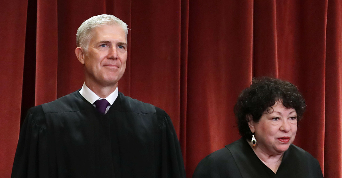United States Supreme Court Justices Neil Gorsuch (L) and Sonia Sotomayor (R) pictured posing for an official court photo.