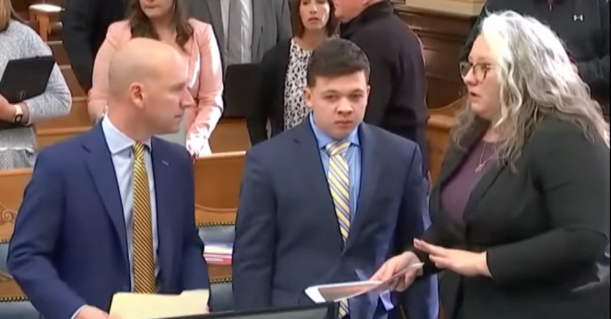 Defense attorney Corey Chirafisi, Kyle Rittenhouse, and defense attorney Natalie Wisco discuss a matter in court. (Image via the Law&Crime Network.)