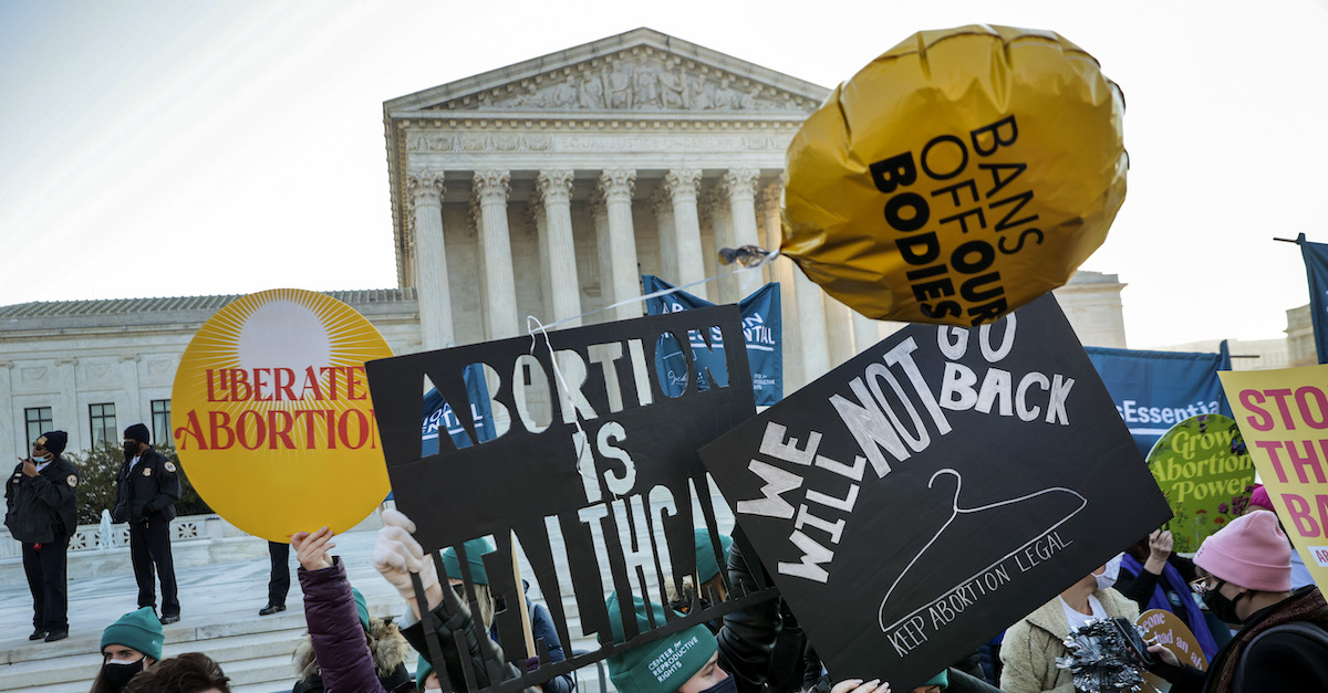 Protesters, demonstrators and activists gather in front of the U.S. Supreme Court on Dec. 1, 2021, as the justices hear arguments in Dobbs v. Jackson Women's Health, a case about a Mississippi law that bans most abortions after 15 weeks. (Photo by Chip Somodevilla/Getty Images)