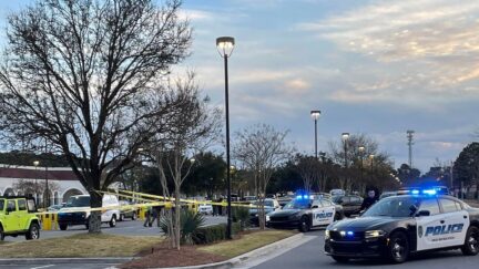 The scene outside of the Landfall Shopping Center in Wilmington, N.C. where Wilbert Lamont Robinson allegedly gunned down three members of his family