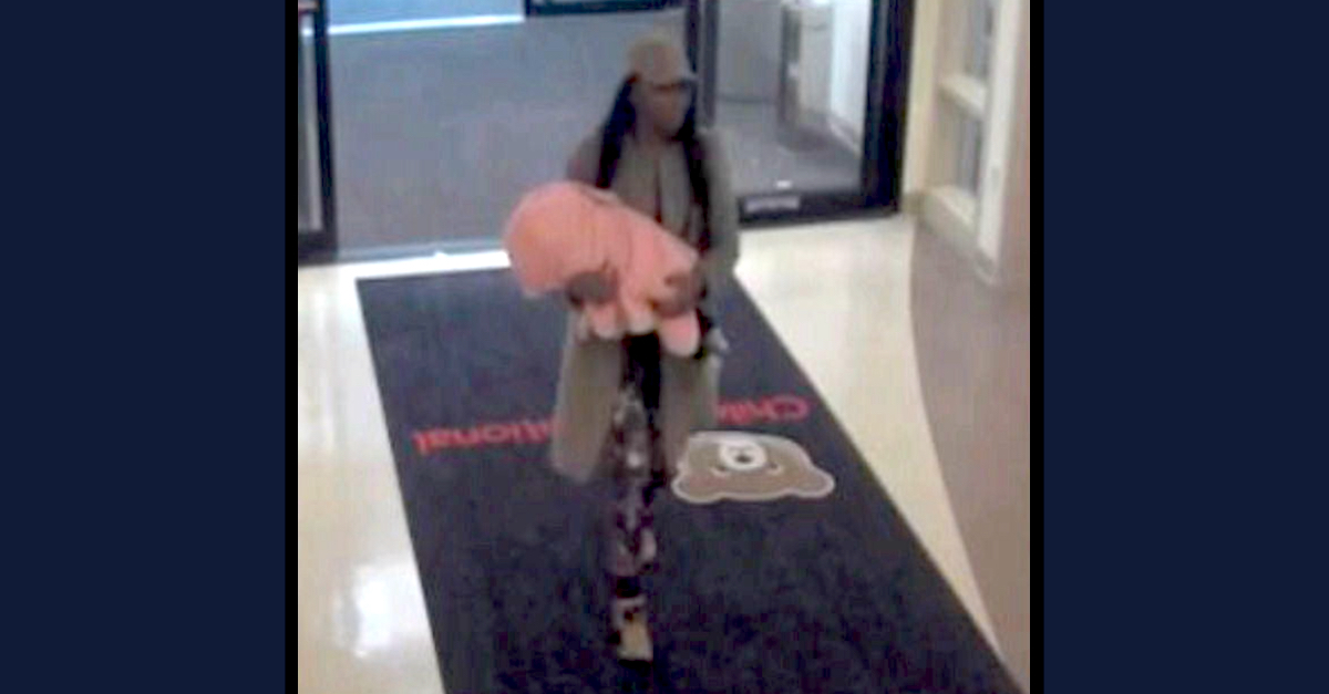Tyra Monae Anderson appears carrying her nonresponsive baby into a hospital in a security camera image embedded within Washington, D.C. Superior Court documents.