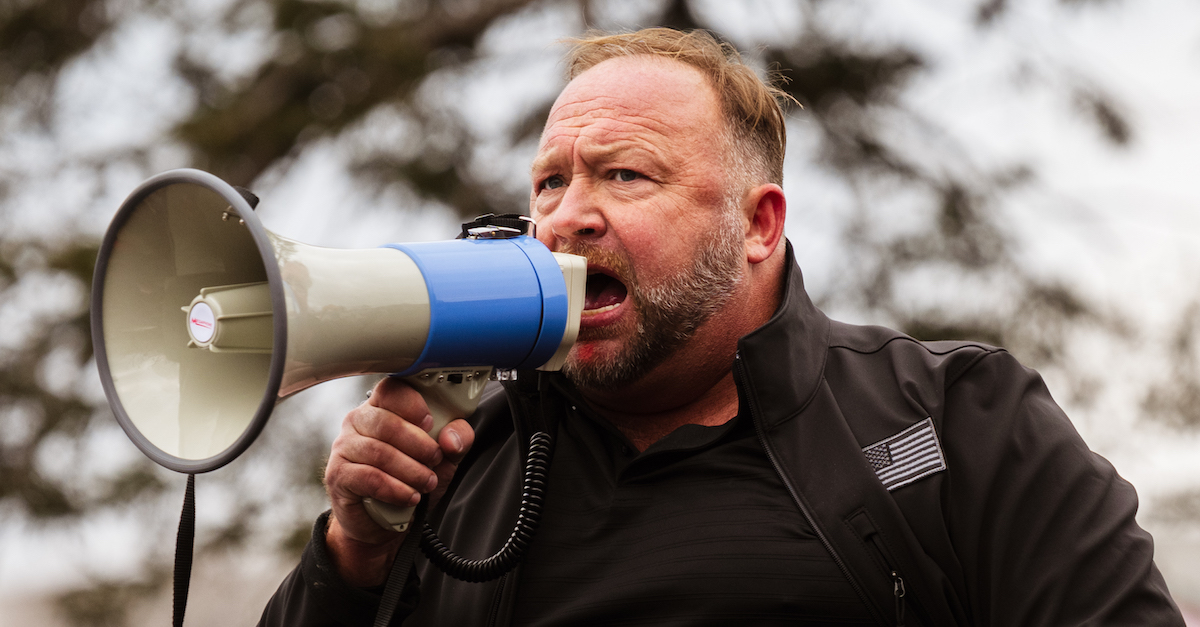 Alex Jones, founder of right-wing media group Infowars, speaks to a crowd of pro-Trump protesters after they stormed the Capitol grounds January 6, 2021 in Washington, DC. (Photo by Jon Cherry/Getty Images.)
