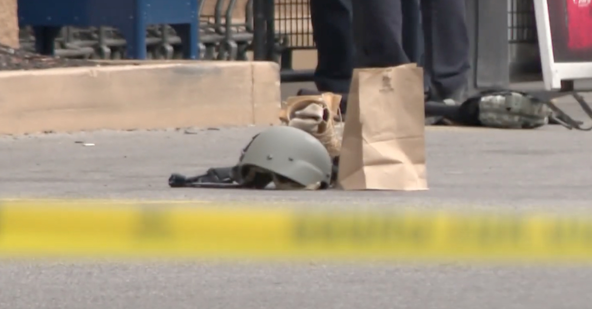 Video recorded by Buffalo NBC affiliate WGRZ shows a helmet and what appears to be an evidence bag at the scene of a grocery store shooting on Sat., May 14, 2022. (Image via YouTube screengrab.)
