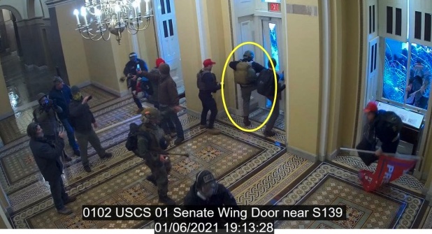 Edward Kelley kicking open the Senate Wing Door in the Capitol on Jan. 6. Image via FBI court filing.