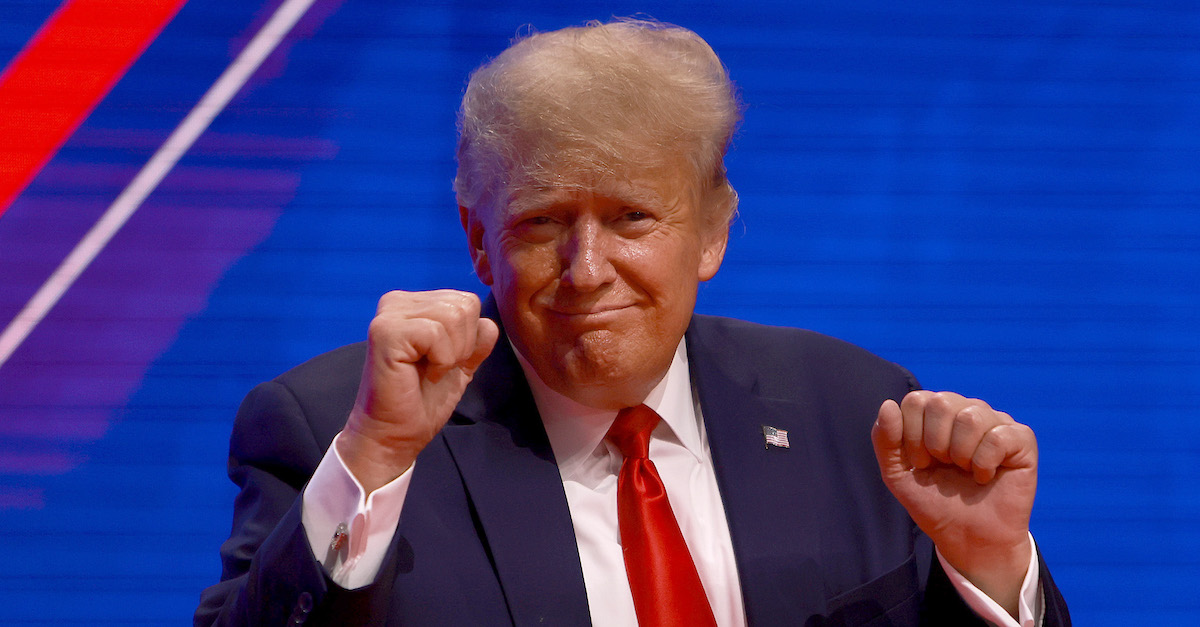 Donald Trump with fists in the air.