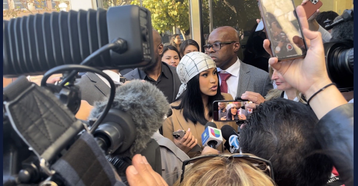 Cardi B surrounded by reporters and fans