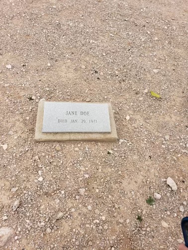 A grave marker for Jane Doe sits in a cemetery in Kingman, Ariz.
