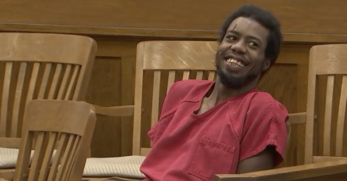 Sterling Traven smiles during his arraignment