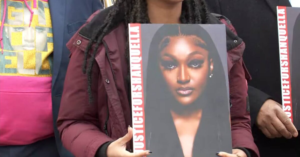 A woman holds a poster calling for justice for Shanquella Robinson at a news conference on Fridya, March 3, 2023. (Screenshot of news conference from Washington, D.C. CBS affiliate WUSA)