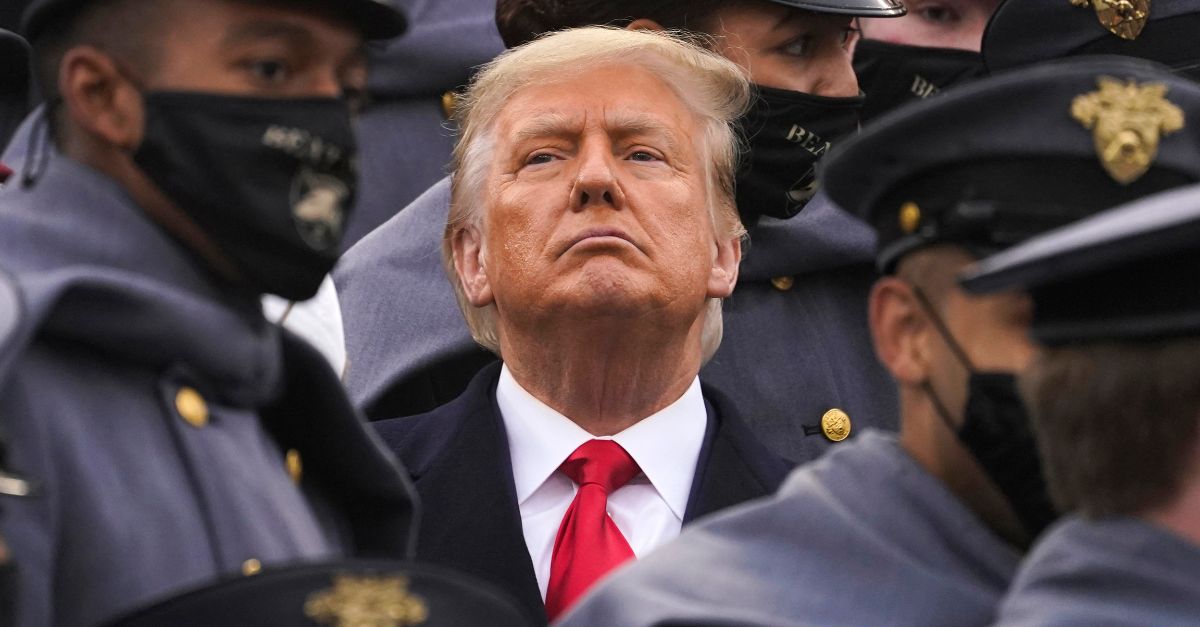 Surrounded by Army cadets, President Donald Trump watches the first half of the 121st Army-Navy Football Game, Dec. 12, 2020, in West Point, N.Y. (AP Photo/Andrew Harnik, File)