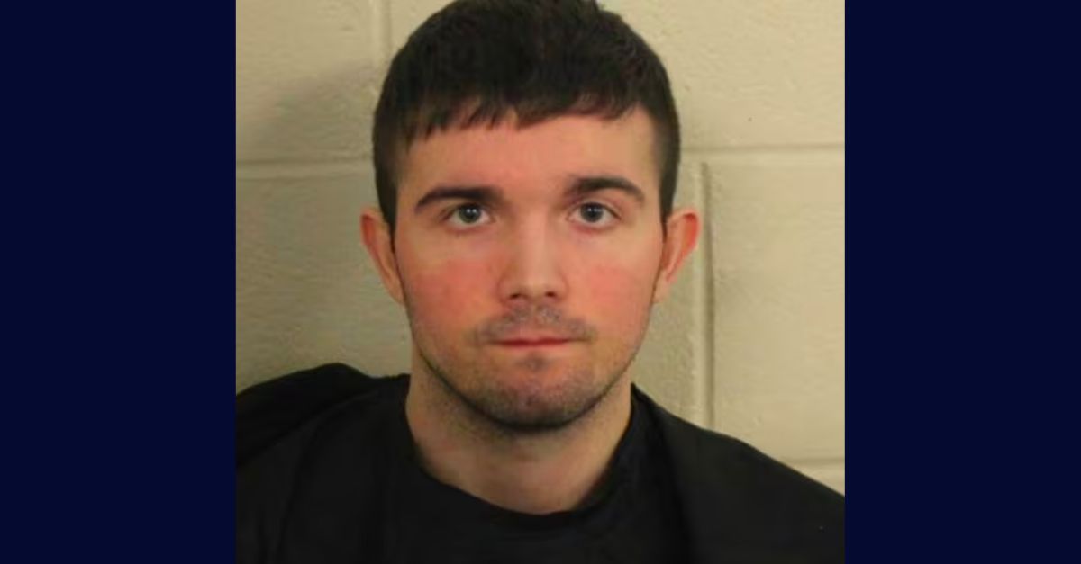 Austin Wray Perkins appears in a booking photo