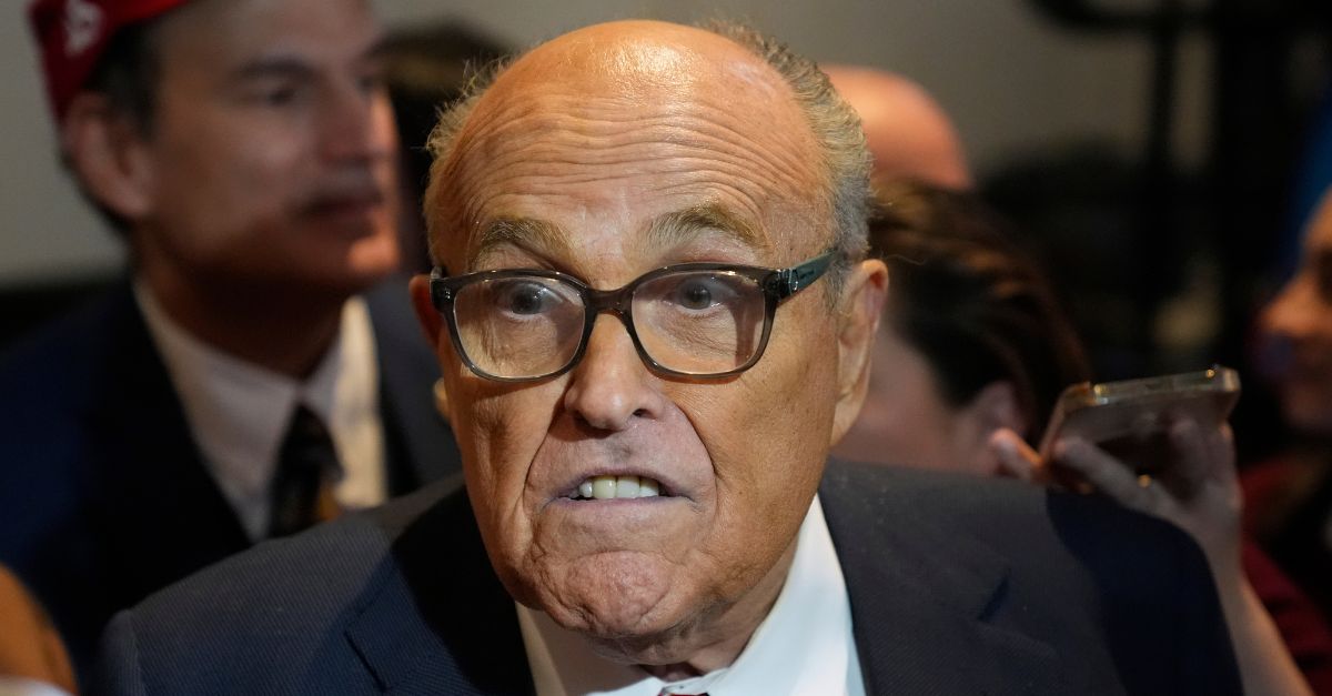 Rudy Giuliani speaks to reporters after Republican presidential candidate former President Donald Trump spoke at a primary election night party in Nashua, N.H., Tuesday, Jan. 23, 2024. (AP Photo/Matt Rourke)