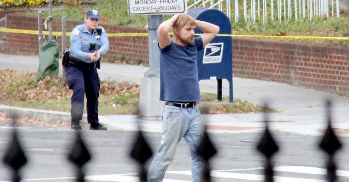 FILE - Edgar Maddison Welch, of Salisbury, N.C., surrenders to police in Washington on Dec. 4, 2016. Comet Ping Pong was targeted in the “Pizzagate” conspiracy, which apparently originated on Twitter and led an armed Welch to burst into the restaurant in 2016 to investigate the claims. Welch later pleaded guilty to illegally transporting firearms over state lines and assault with a dangerous weapon. He was sentenced to four years in prison. (Sathi Soma via AP, File) 