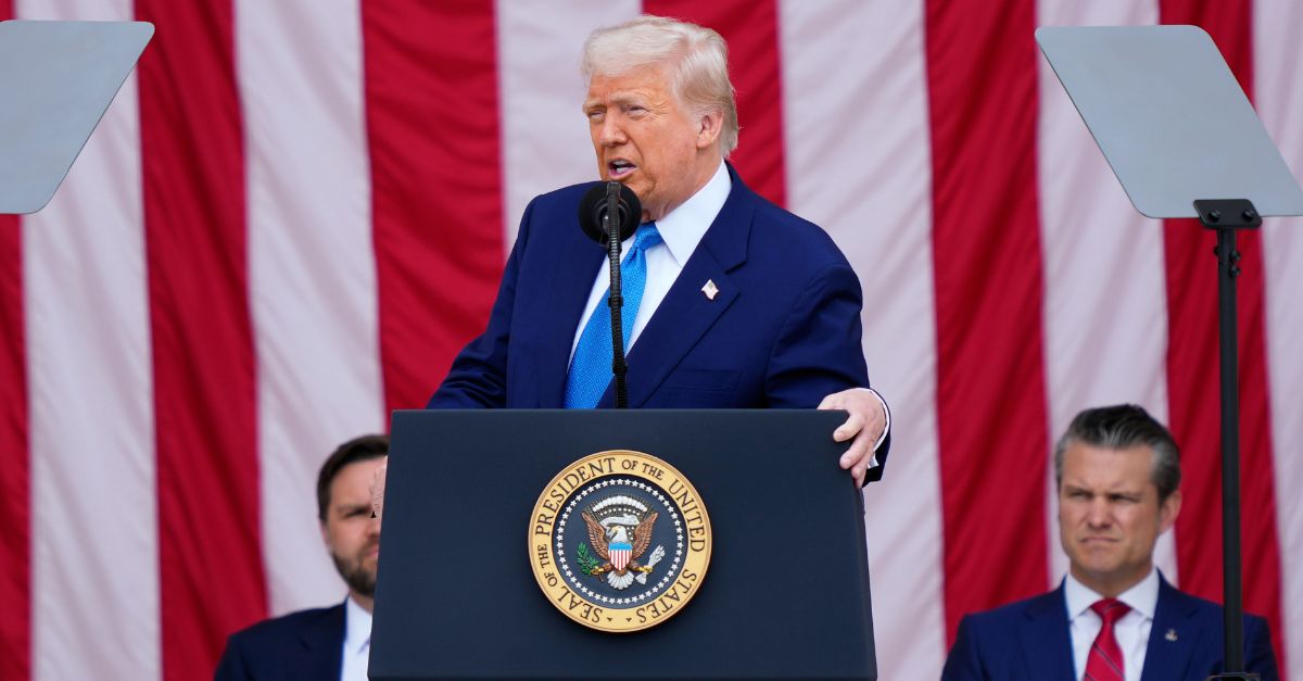 Donald Trump is flanked by J.D. Vance on the left and Pete Hegseth on the right.