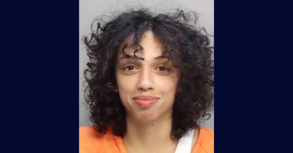 Esther Torres appears in a booking photo.