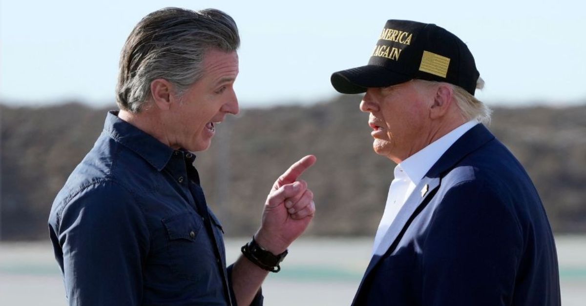 FILE – President Donald Trump listens to California Gov. Gavin Newsom after arriving on Air Force One at Los Angeles International Airport in Los Angeles, Jan. 24, 2025. (AP Photo/Mark Schiefelbein, File).
