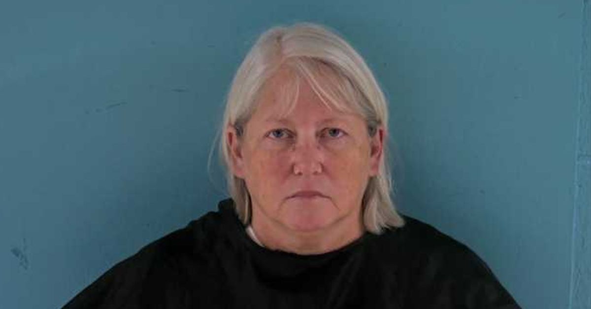 Anna Adamo appears in a booking photo.