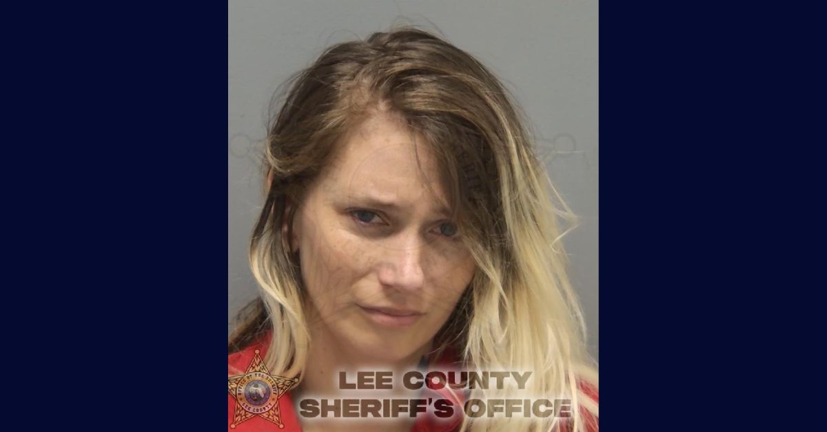 Krysten Happel appears in a booking photo.