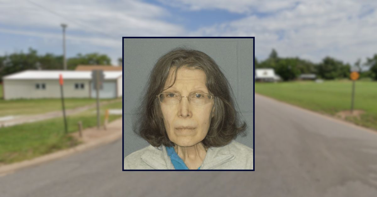 Linda Oeding appears in a booking photo inset against an image of Main Street in a rural Kansas town.