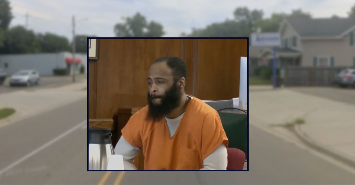 William Deandre-Kashawn Smith appears in court inset against an image of a street in Michigan.