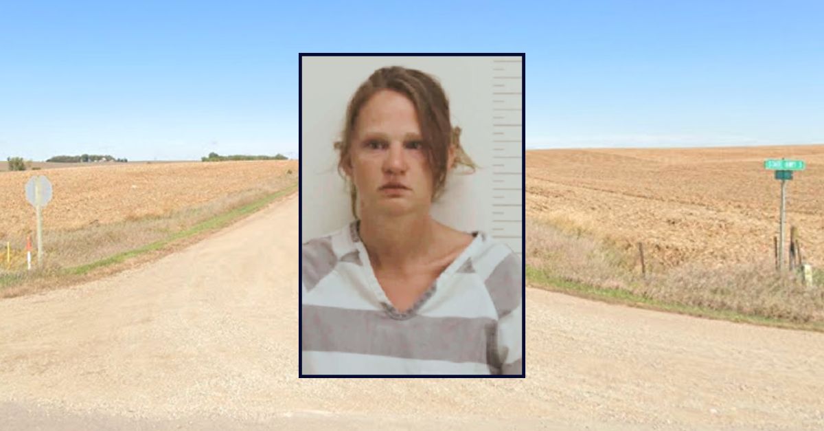 Ashley M. Ruhland appears in a booking photo inset against a rural stretch of land in Iowa